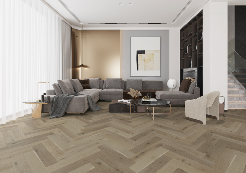 herringbone-patterned hardwood flooring in living room with vintage decor.